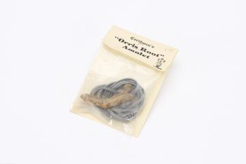 'Orris Root' amulet in plastic packet with paper label 'worn to find and hold love'