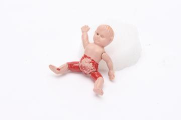 Baby figurine for tortoise toy made from paper offcuts