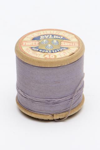 One wooden silk substitute cotton thread spool with purple thread by Dewhurst Sylko, Yorkshire, 1938-1959
