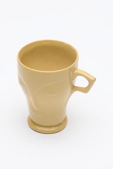 Ceramic mug moulded into the form of a face