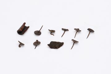 Eight pins, seven with washers, and three leather bits, from the Royal Mail Coach, 1815-1830
