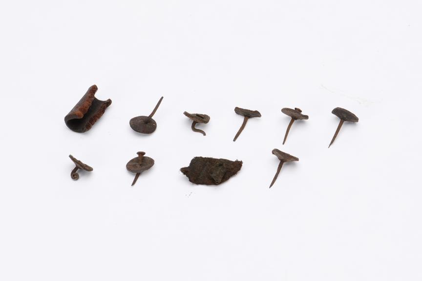 Eight pins, seven with washers, and three leather bits, from the Royal Mail Coach, 1815-1830