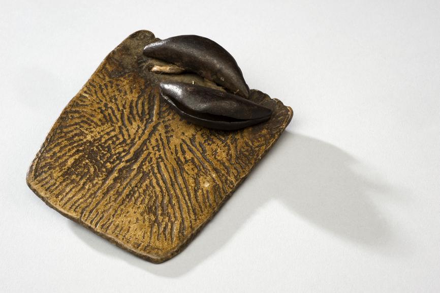 Divination plaque, hide, one with 2 bells, Uganda